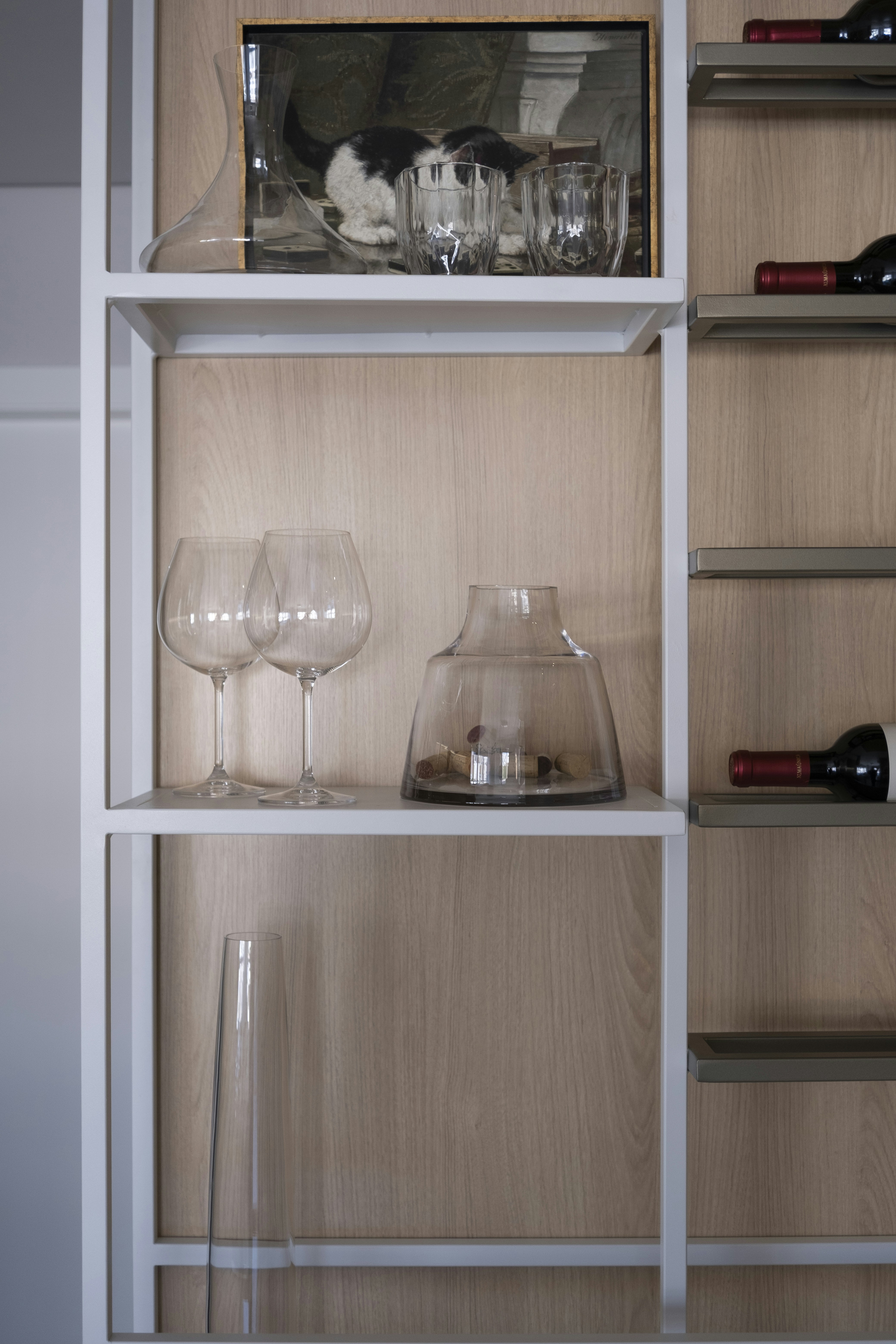 Shelving unit with wine bottles and glassware