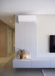 Modern living room with air conditioner and decor