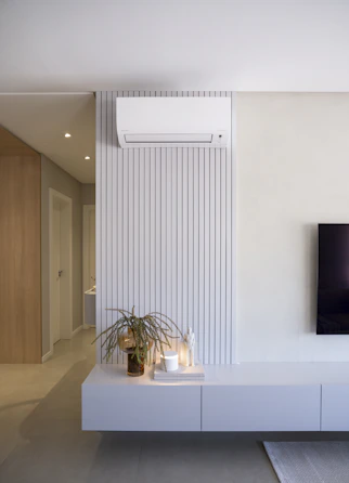 Modern living room with air conditioner and decor