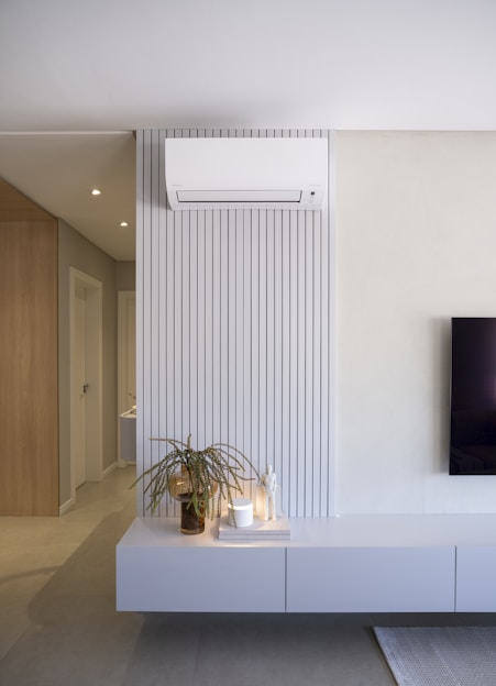 Modern living room with air conditioner and decor