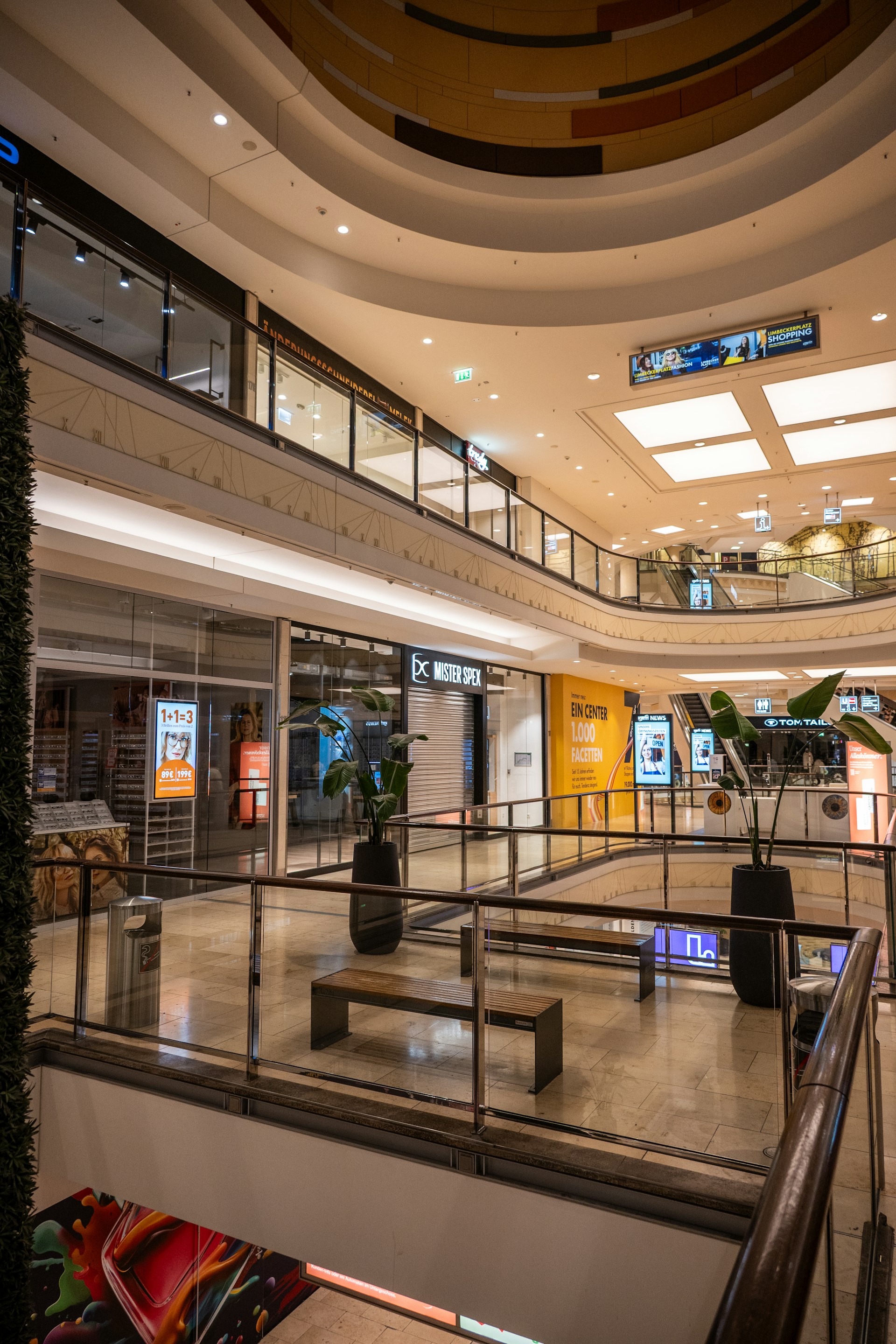 Interior of a modern shopping mall with multiple levels.