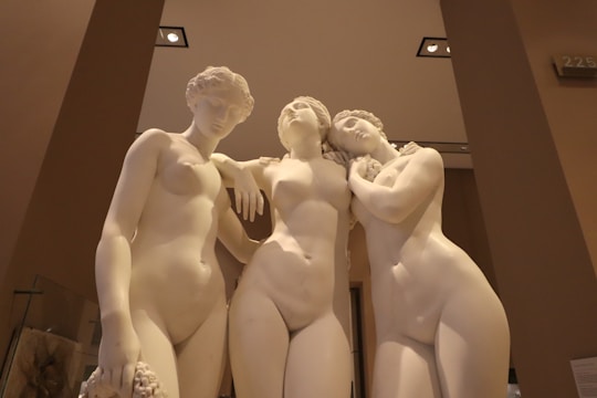 Three classical marble statues of women