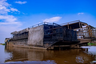 Two rustic boats docked on a river