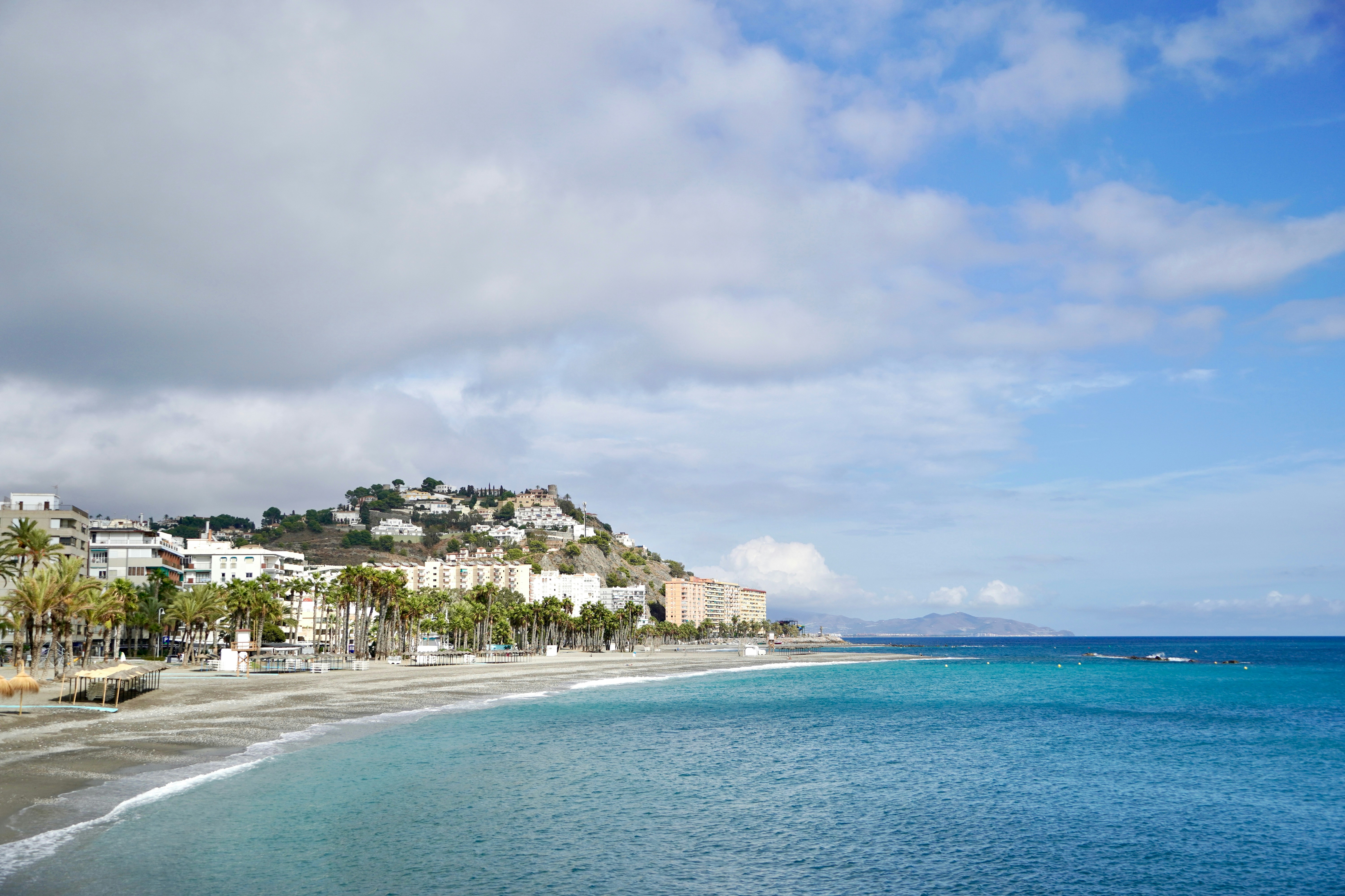 Coastal town with beach and turquoise ocean water