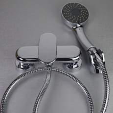 Chrome bathtub faucet with handheld showerhead