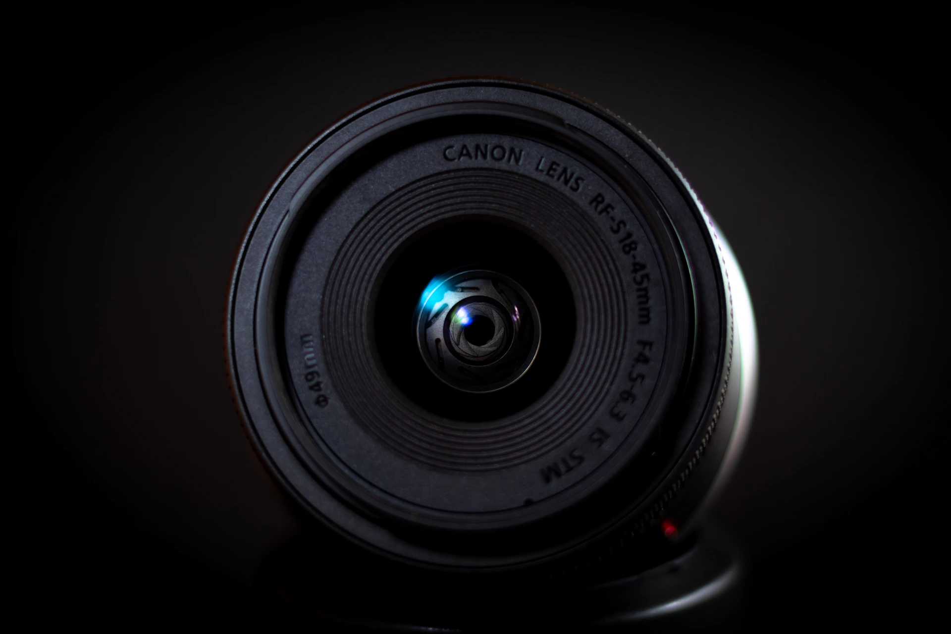 Close-up of a camera lens with reflection