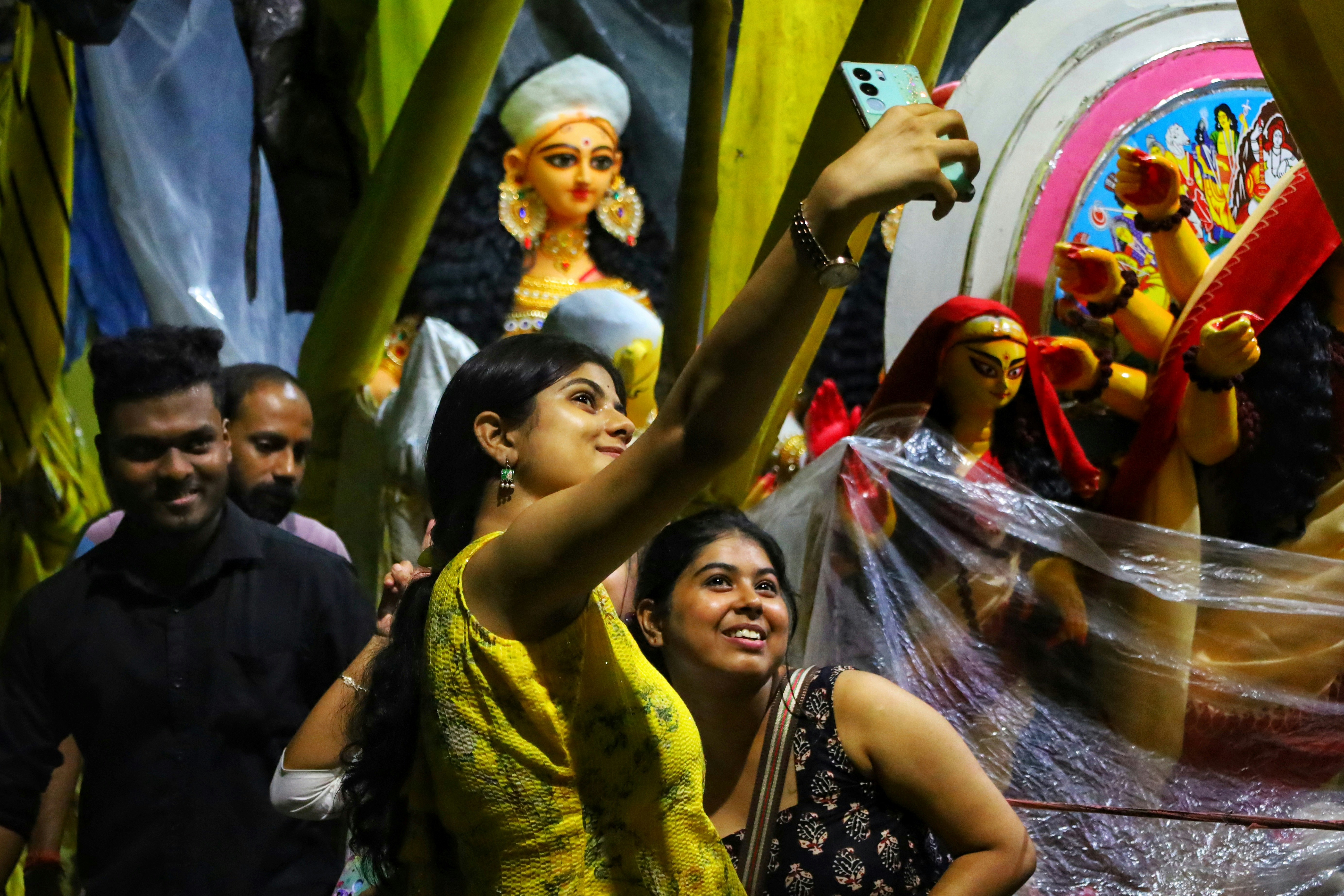 Women taking selfie at ceremony