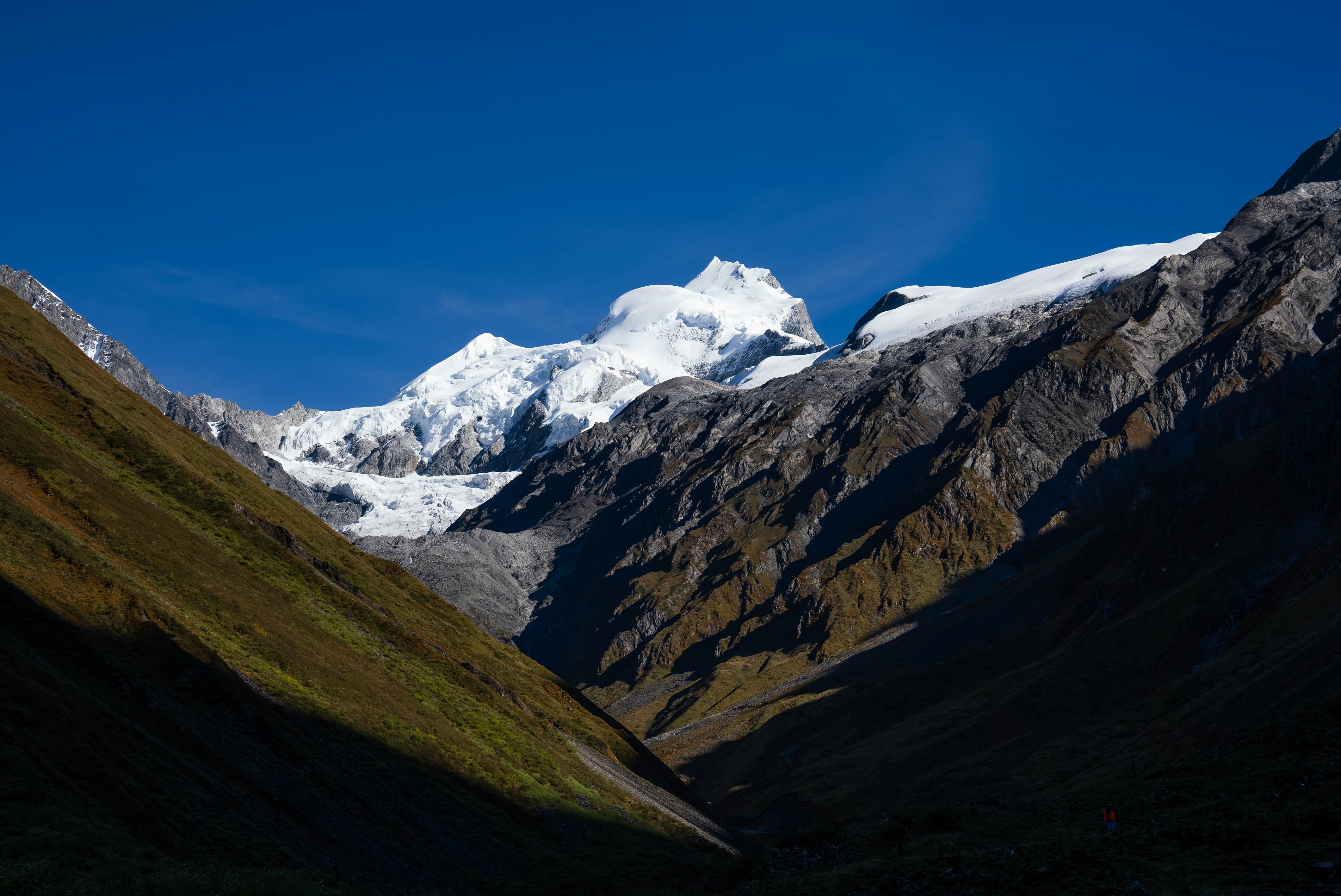 Snow-capped mountains under a clear blue sky.