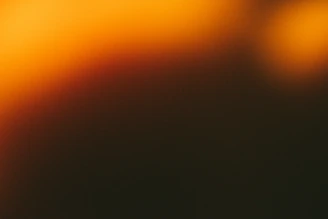 Abstract warm orange and dark gradient background
