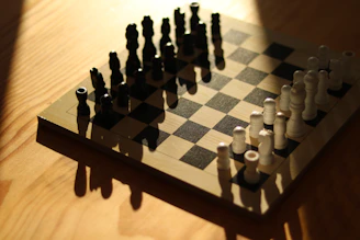 Chessboard with black and white pieces ready to play