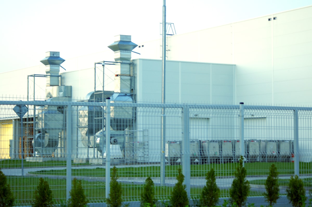 Industrial ventilation units on the exterior of a building, essential for maintaining controlled temperature in pharmaceutical warehouses