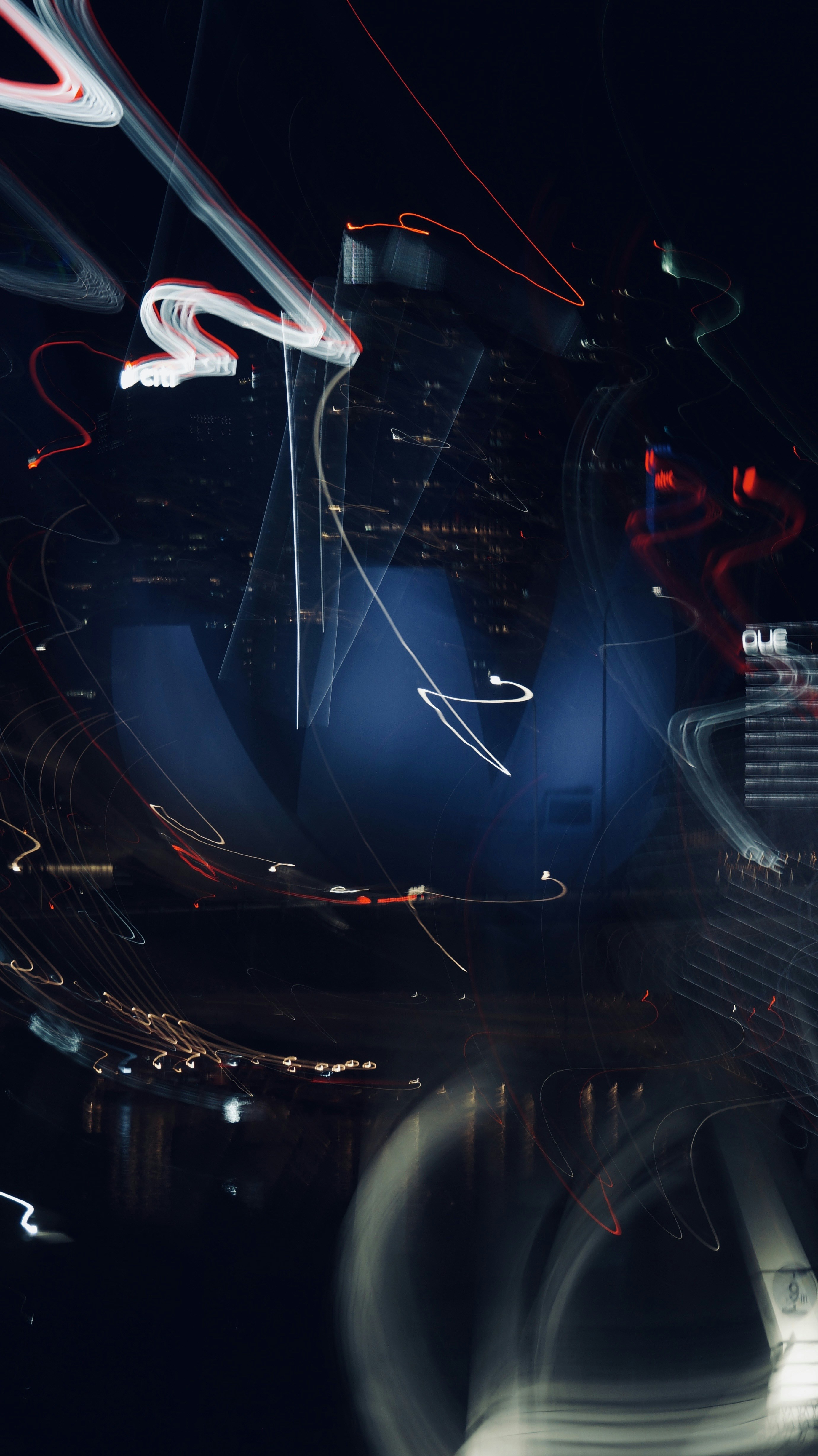 Abstract light trails over a dark cityscape at night cityscape