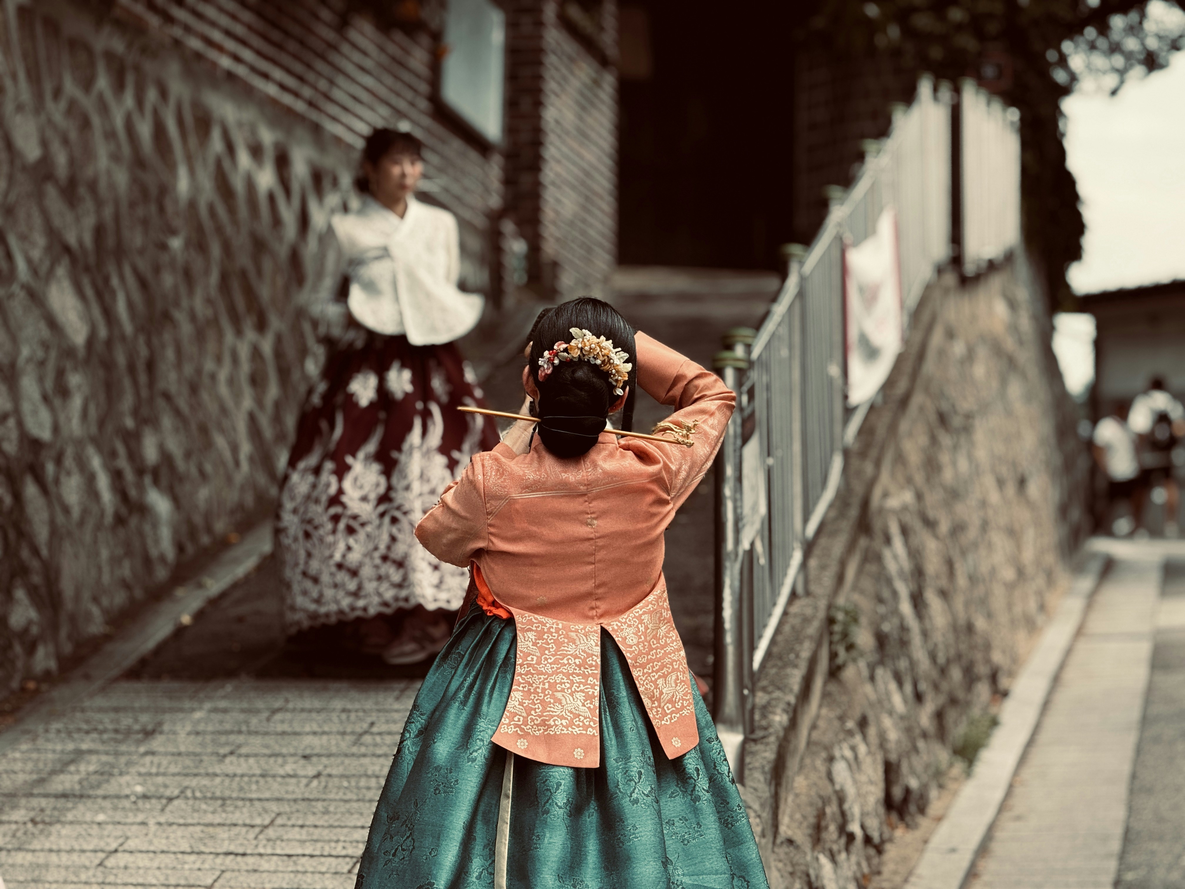 Two women in traditional korean hanbok outfits
