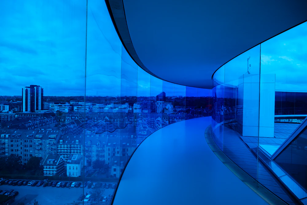 Modern building overlooking the city at dusk