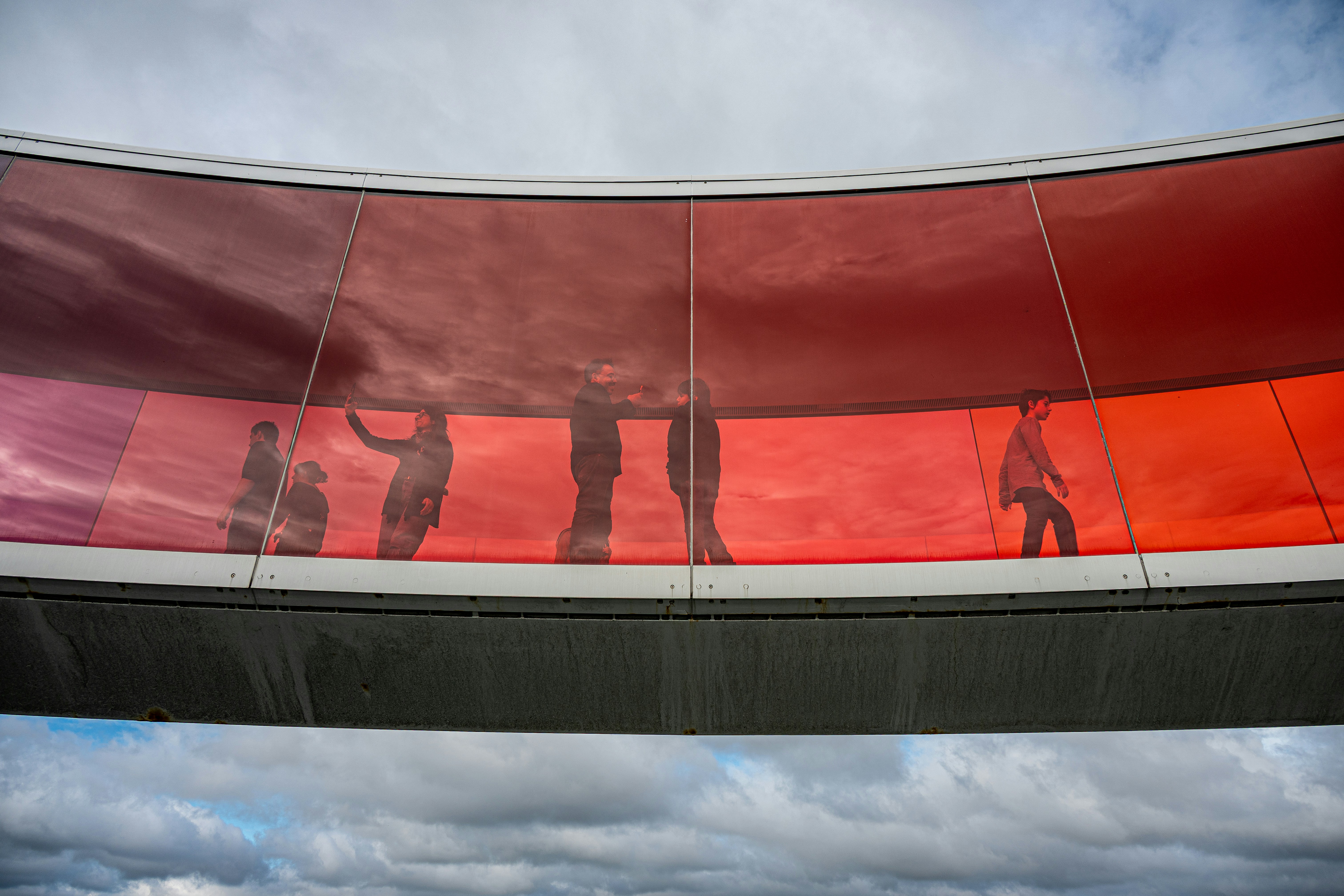 People walking on a colorful rainbow bridge