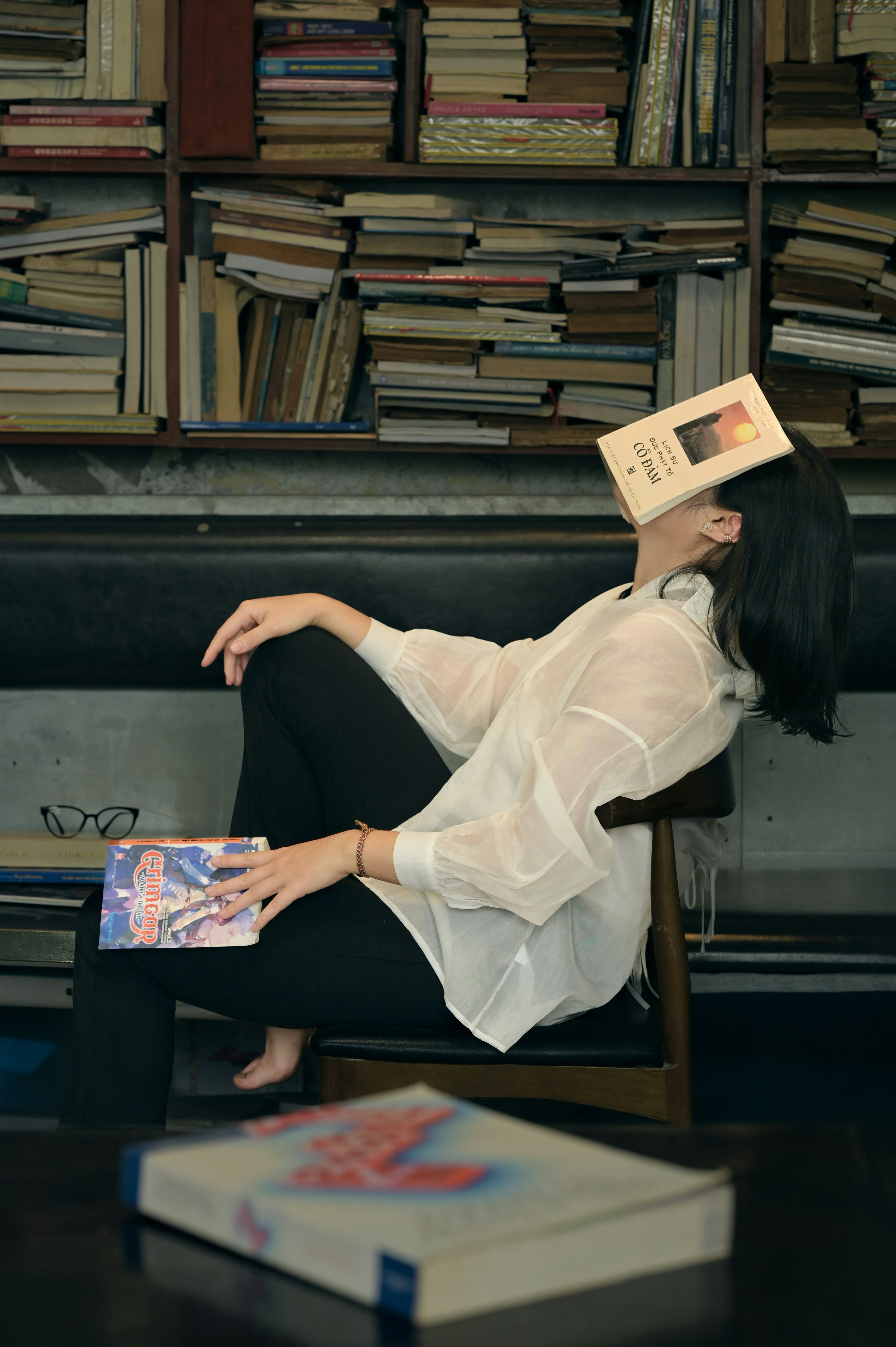 Woman sleeping with book on her face