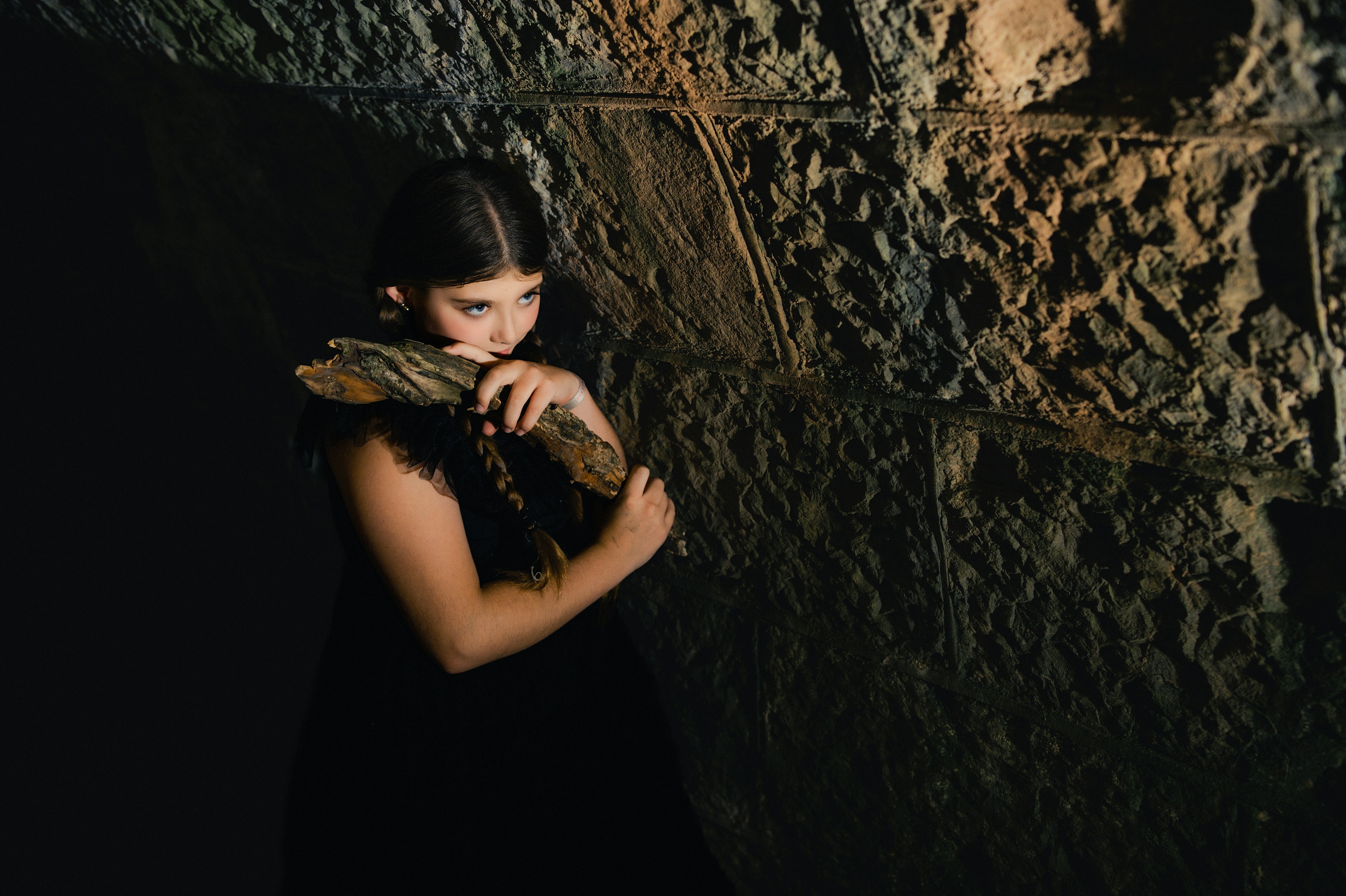 Young woman holding a piece of wood