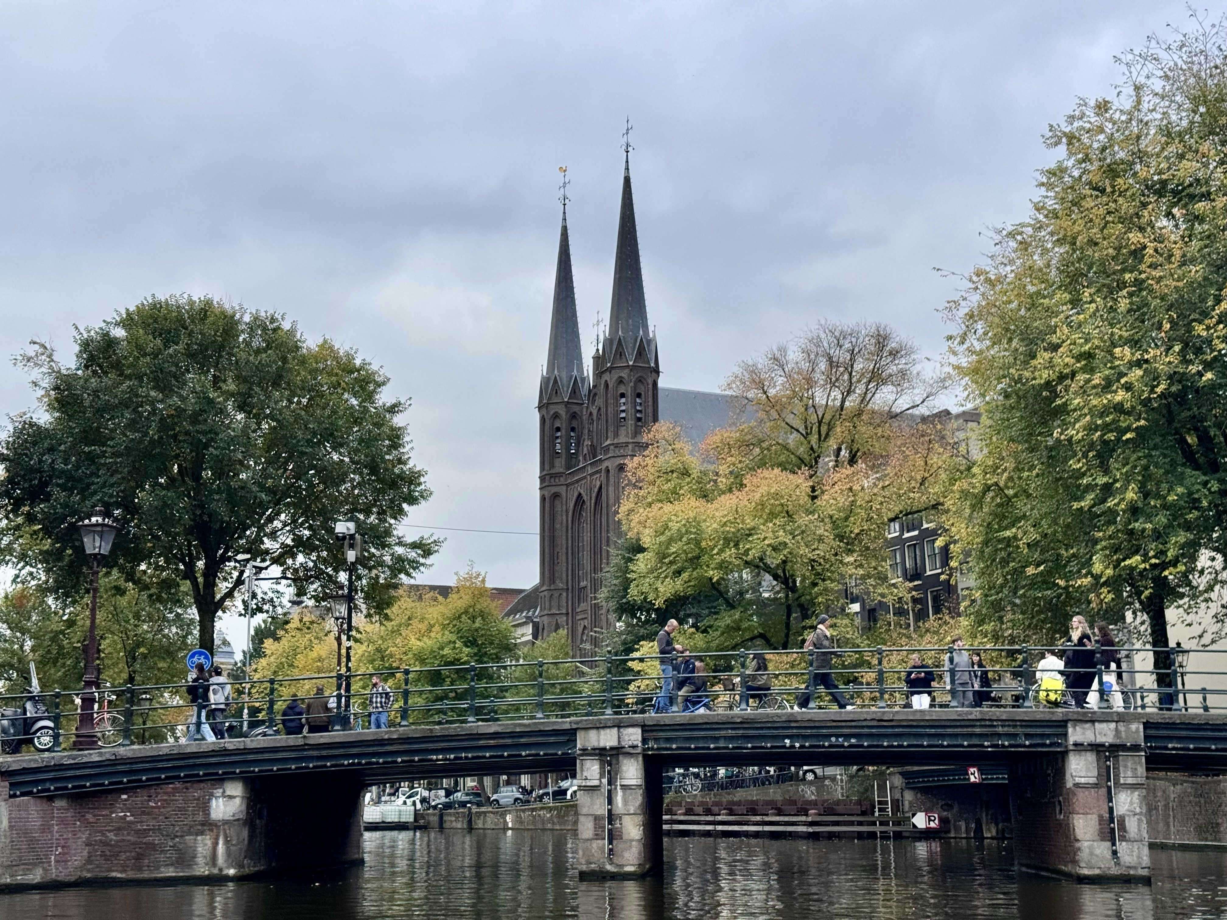 Canal bridge with church and autumn trees