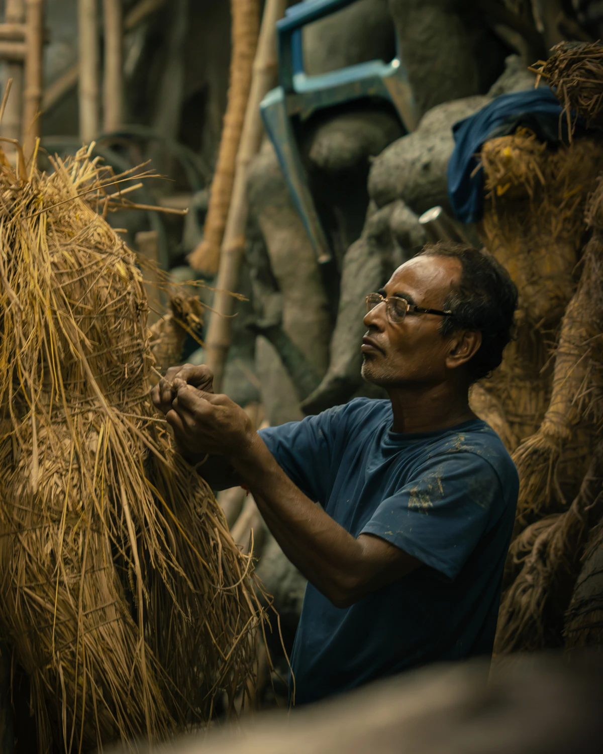 Craftsman working with straw and bamboo