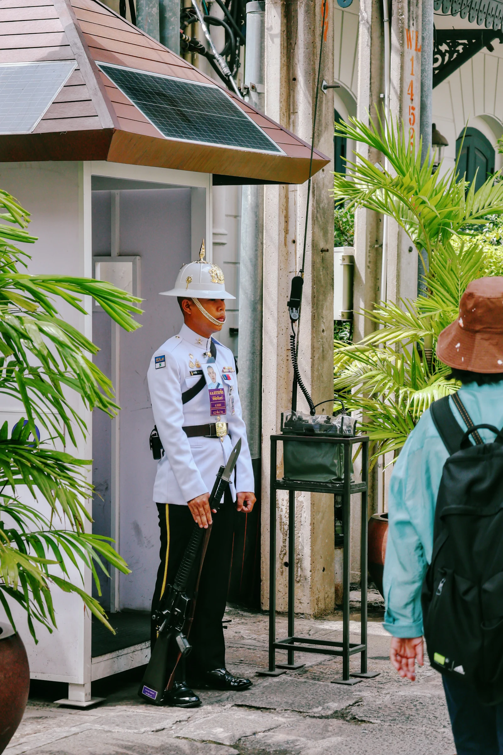 Guard in uniform at the society gate booth