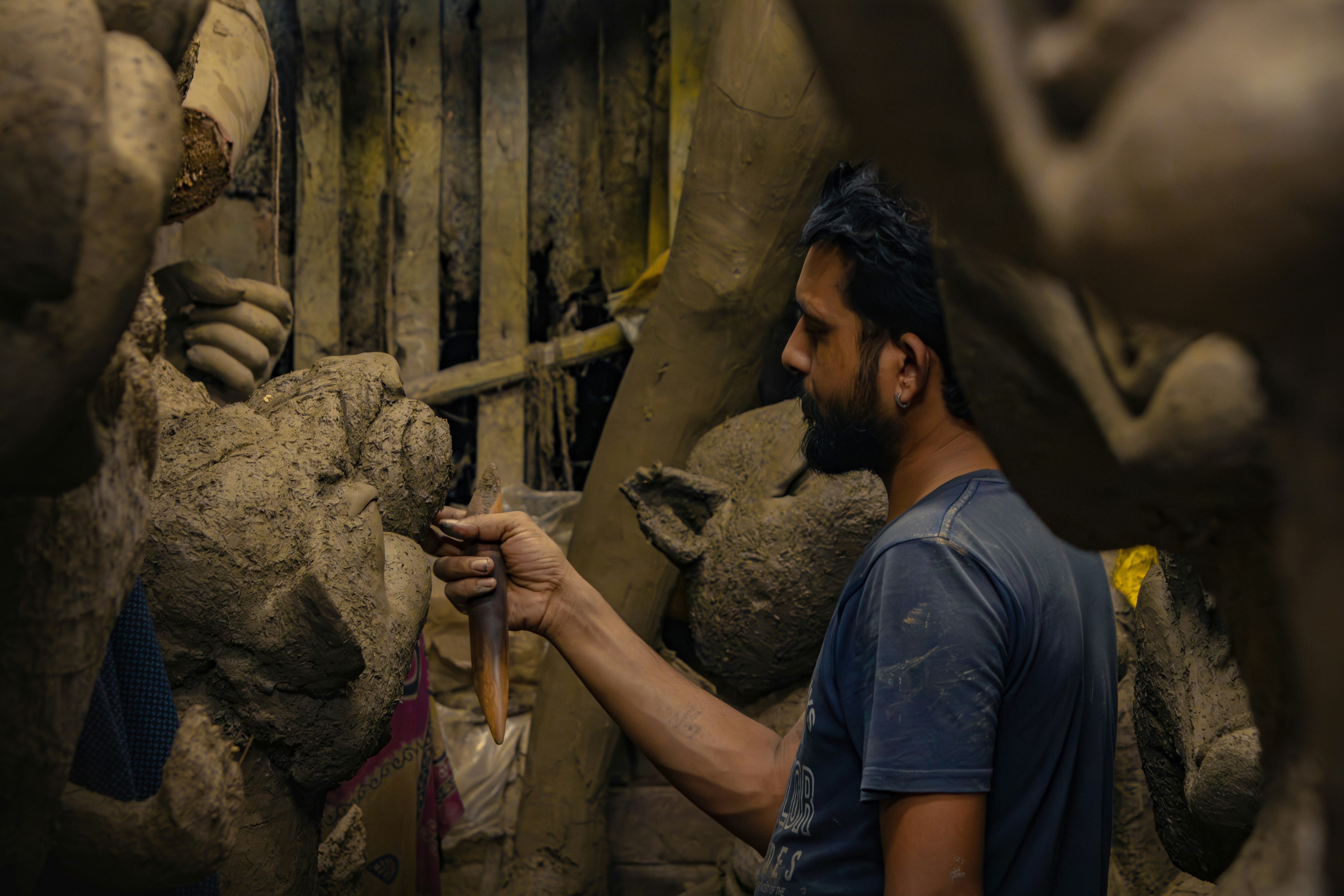 Artist sculpting clay