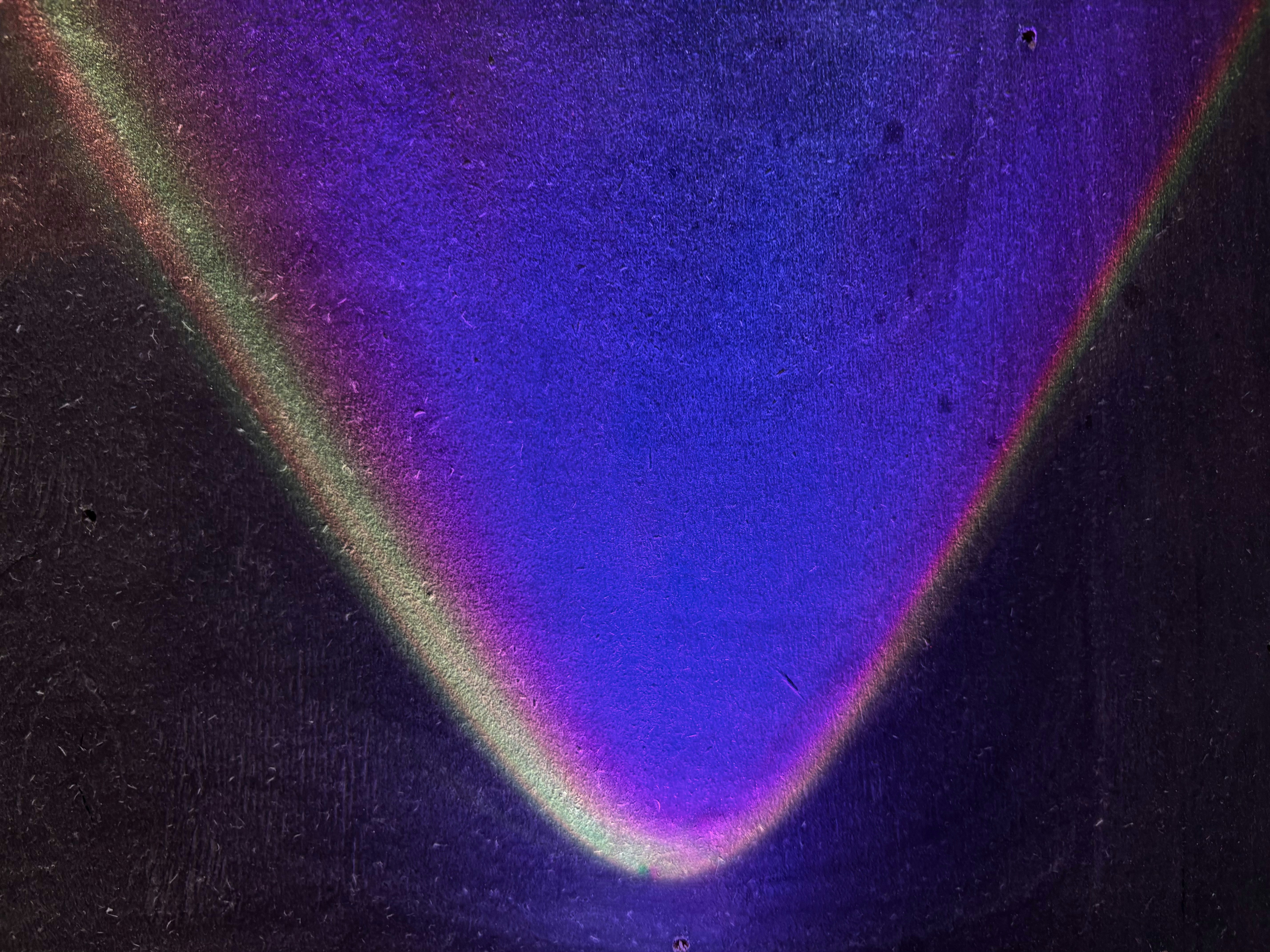 Abstract purple and blue gradient with light streaks