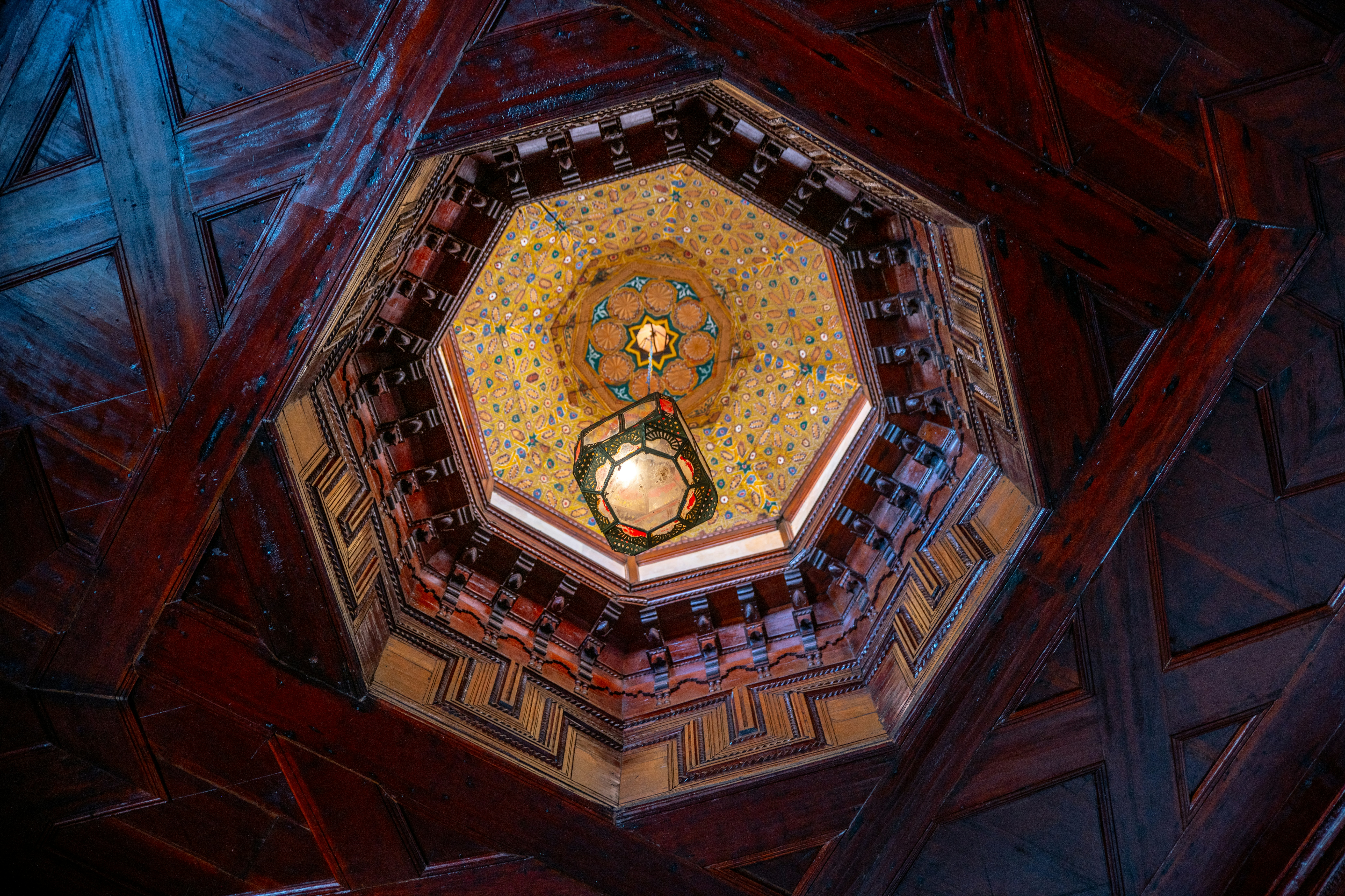 Octagonal ceiling with ornate details and lantern