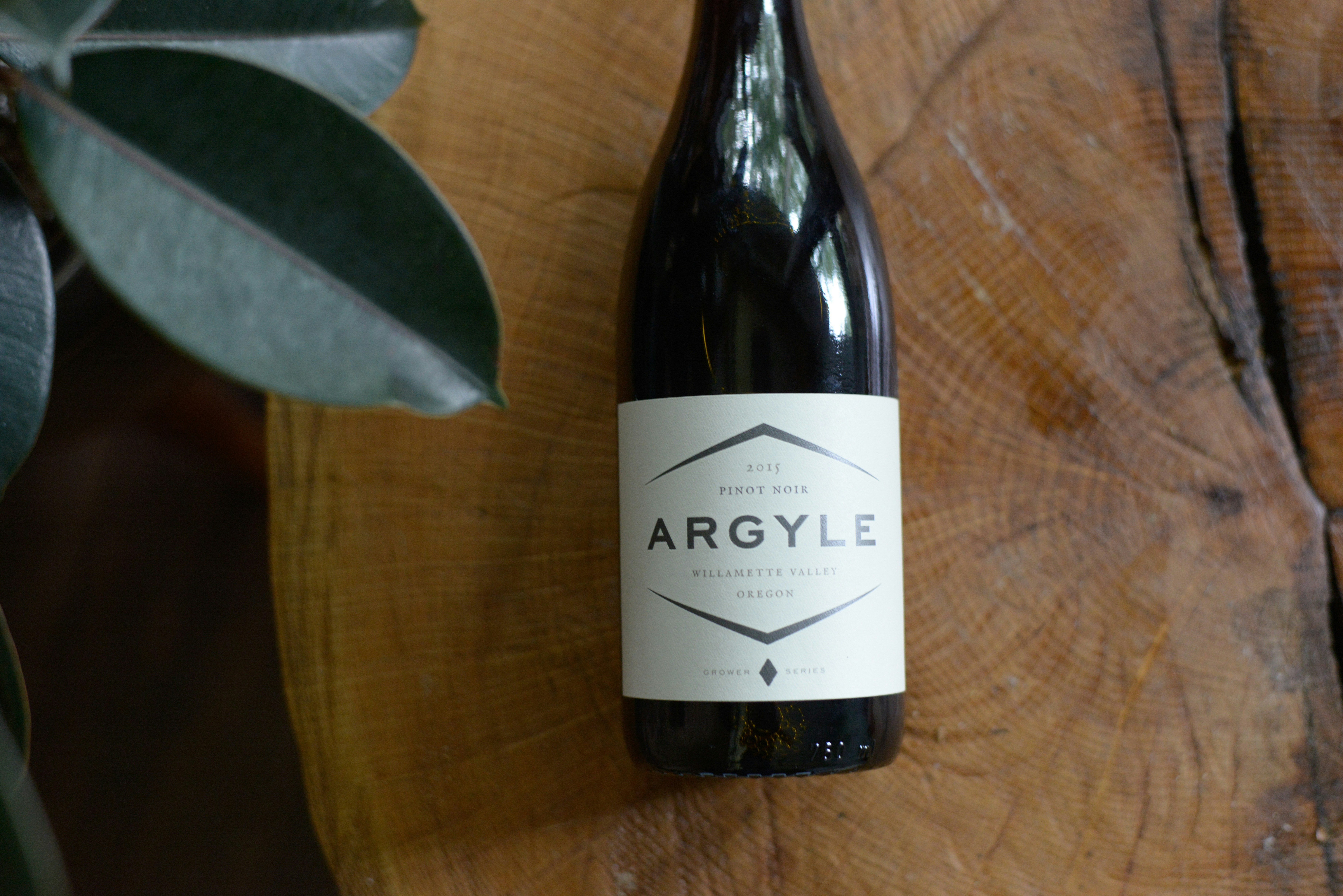 Bottle of argyle wine on a wooden surface