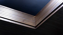 Stack of dark blue and metallic sheets