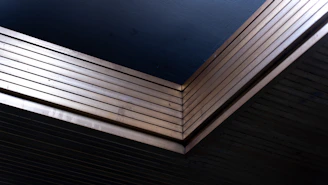 Stack of dark blue and metallic sheets