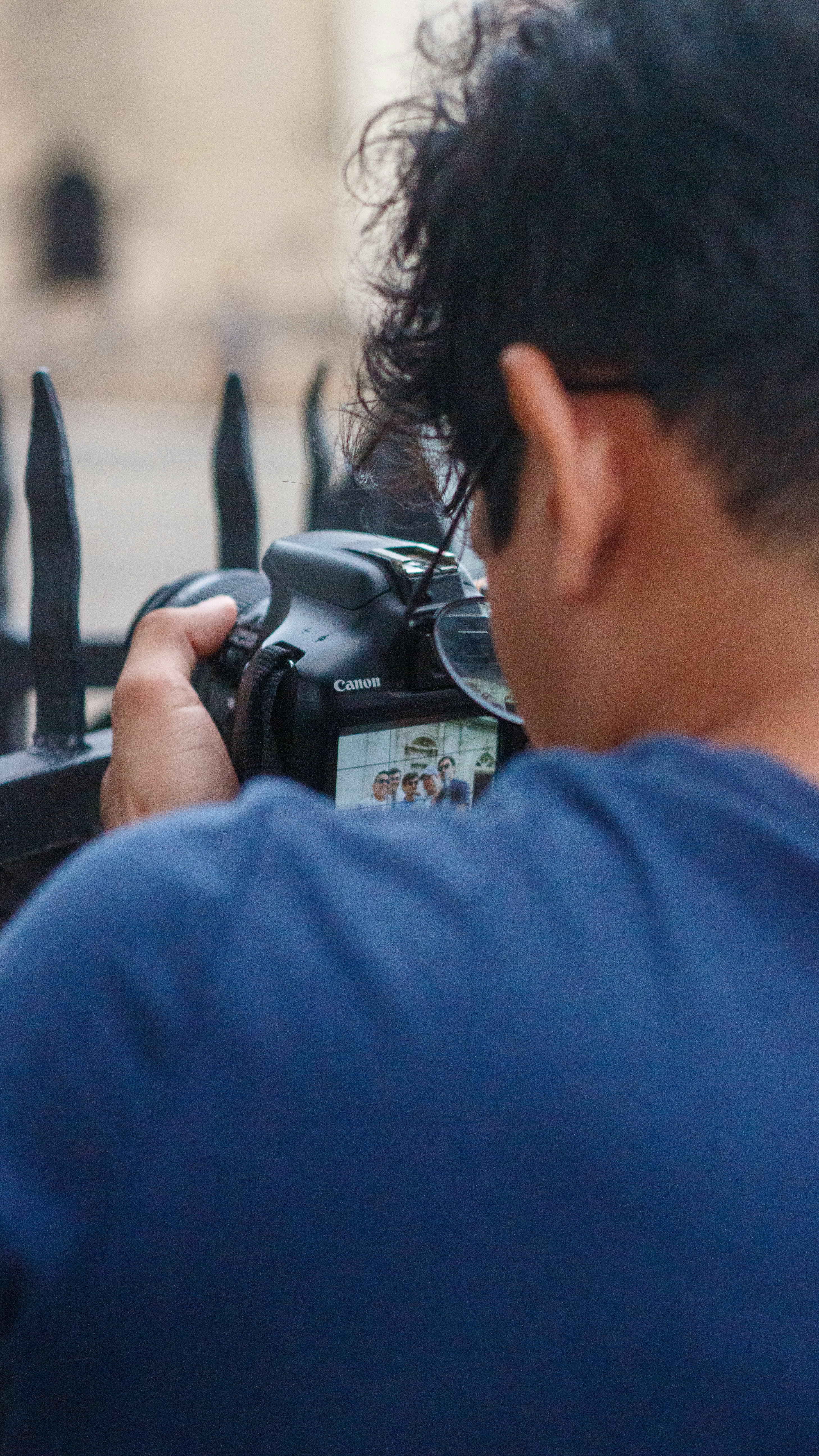 Person holding a camera and taking a picture.