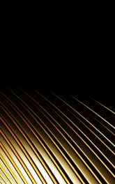 Golden metallic lines against a black background