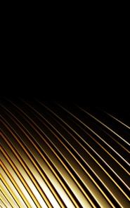 Golden metallic lines against a black background