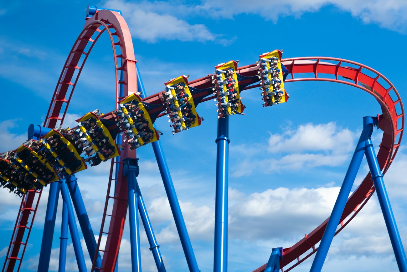 Riders enjoying a theme park roller coaster