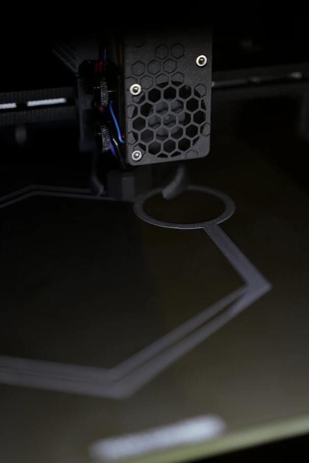 3D printer creating a hexagonal shape