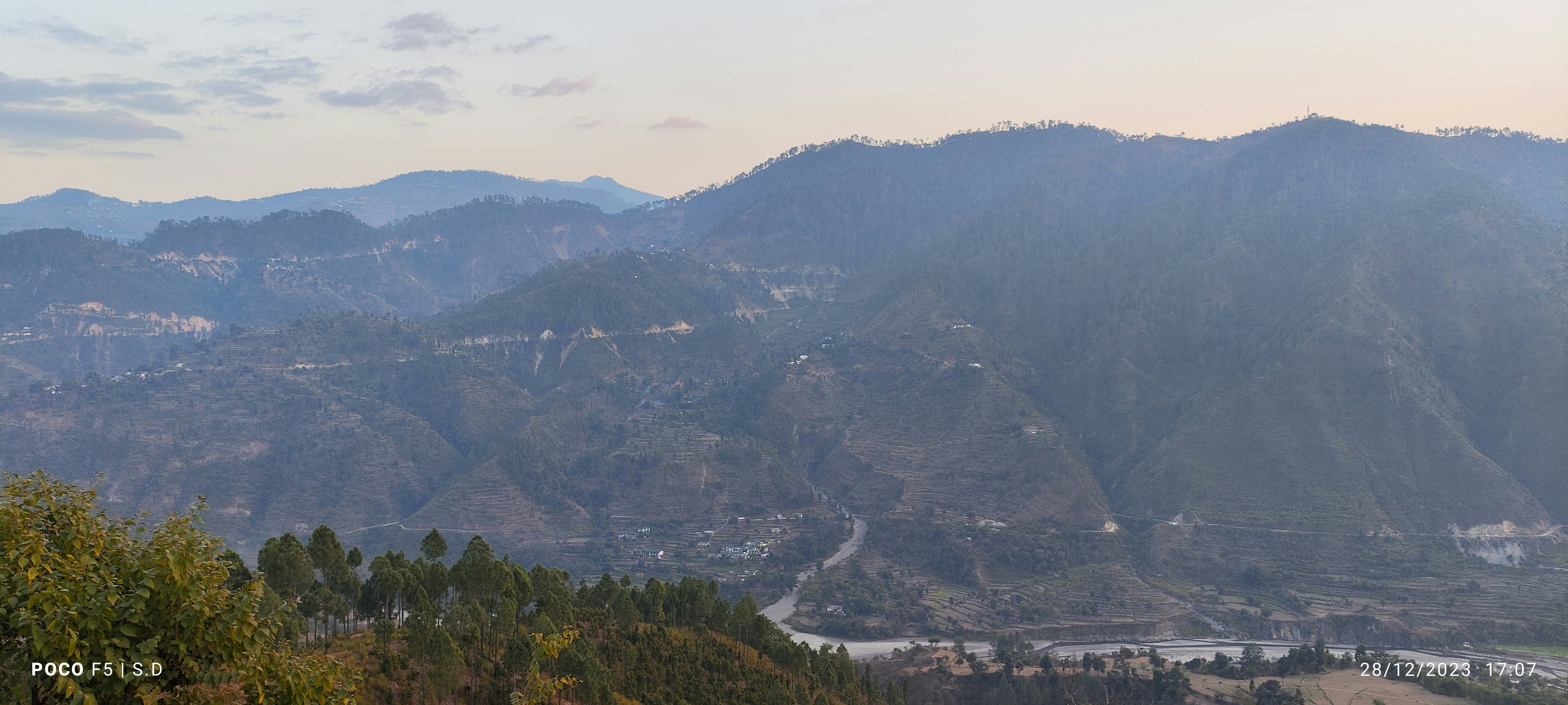 A modern tunnel boring machine (TBM) at work inside one of the Rishikesh-Karnaprayag rail project tunnels, with workers in safety gear.
