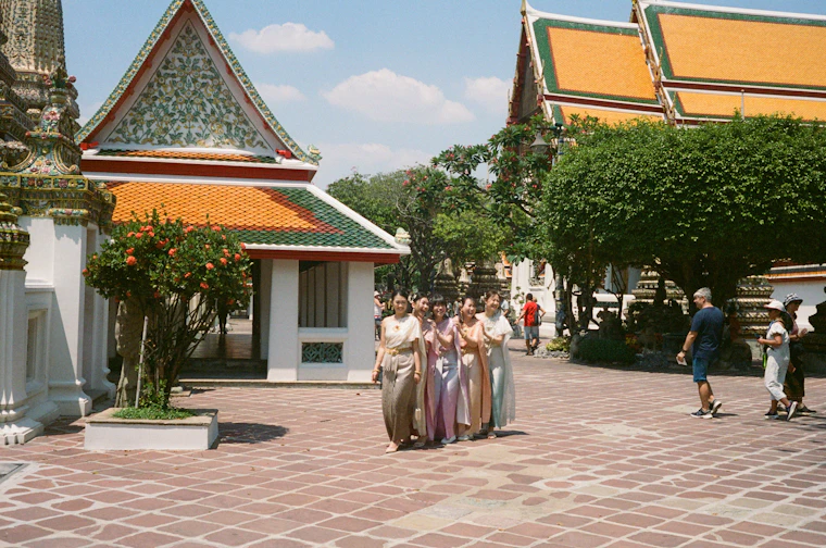 Travellers visiting a temple in Thailand