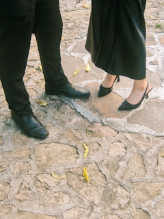 Couple's feet on a stone path