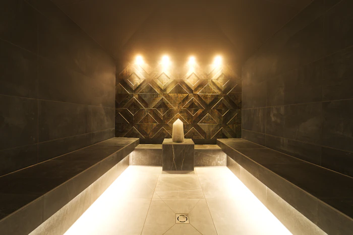 Steam room with candles and soft lighting