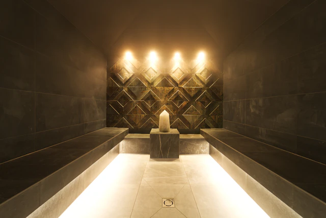 Steam room with candles and soft lighting