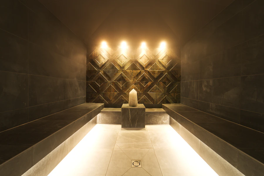 Steam room with candles and soft lighting