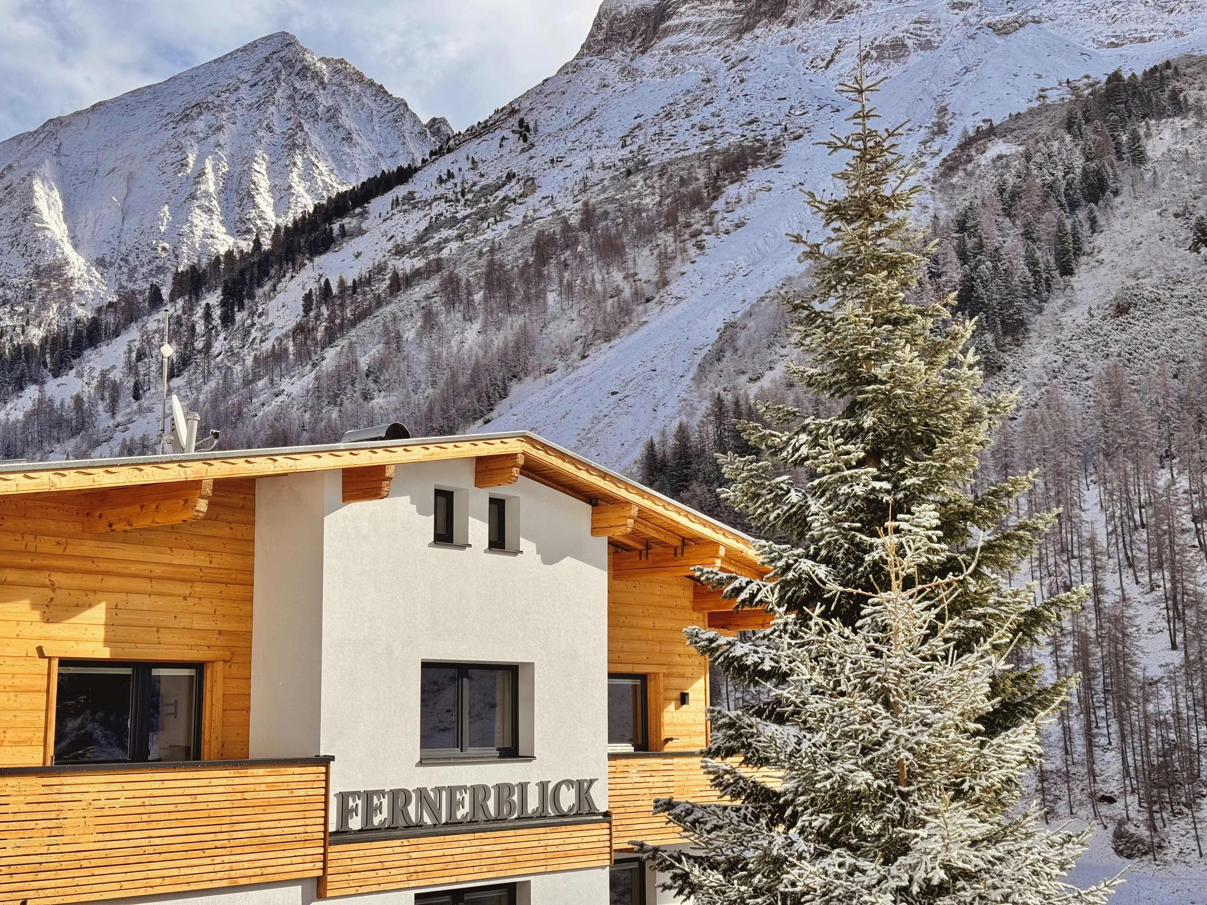 Modern wooden building in snowy mountains