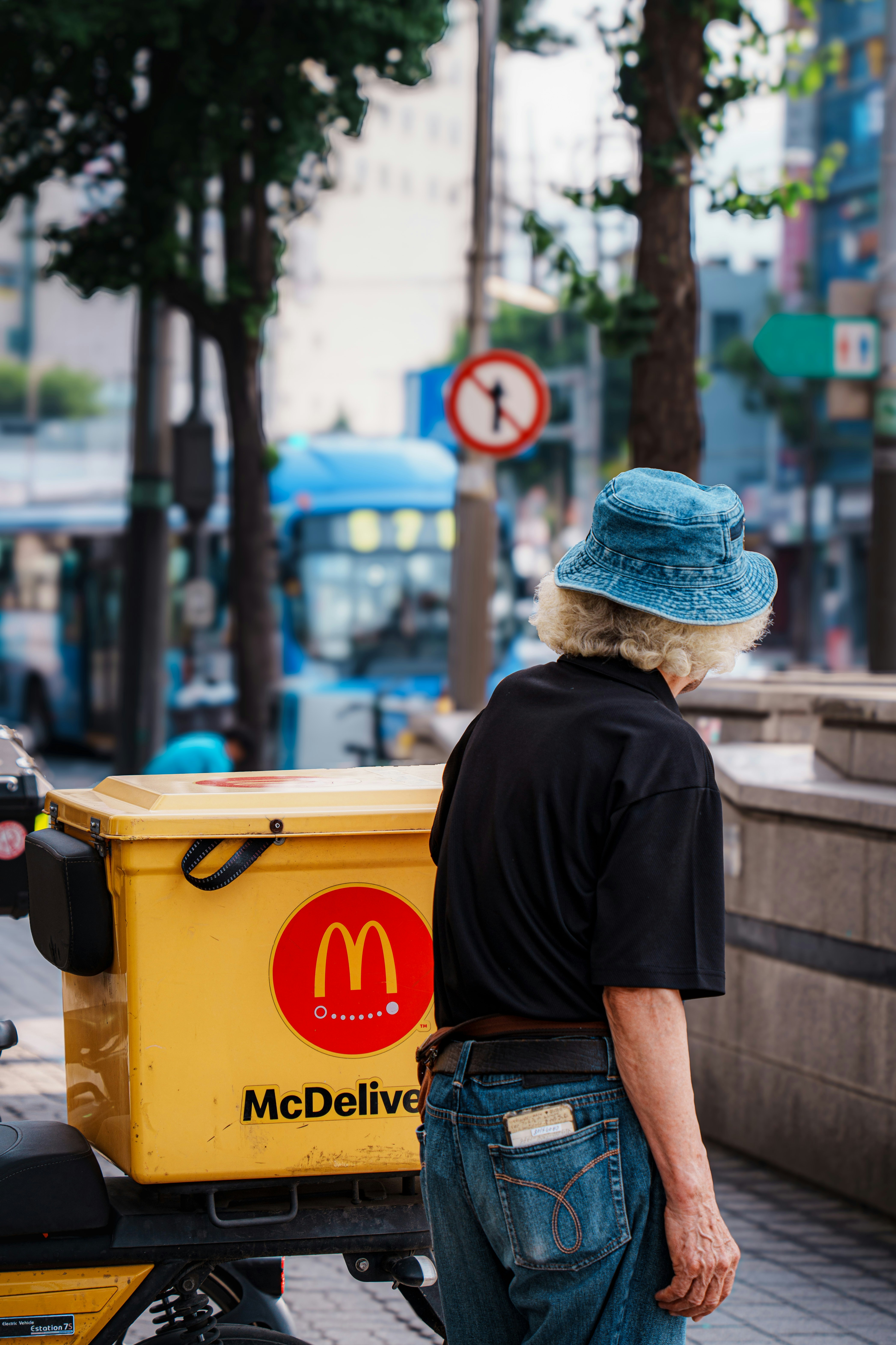 Person standing next to mcdonald's delivery box