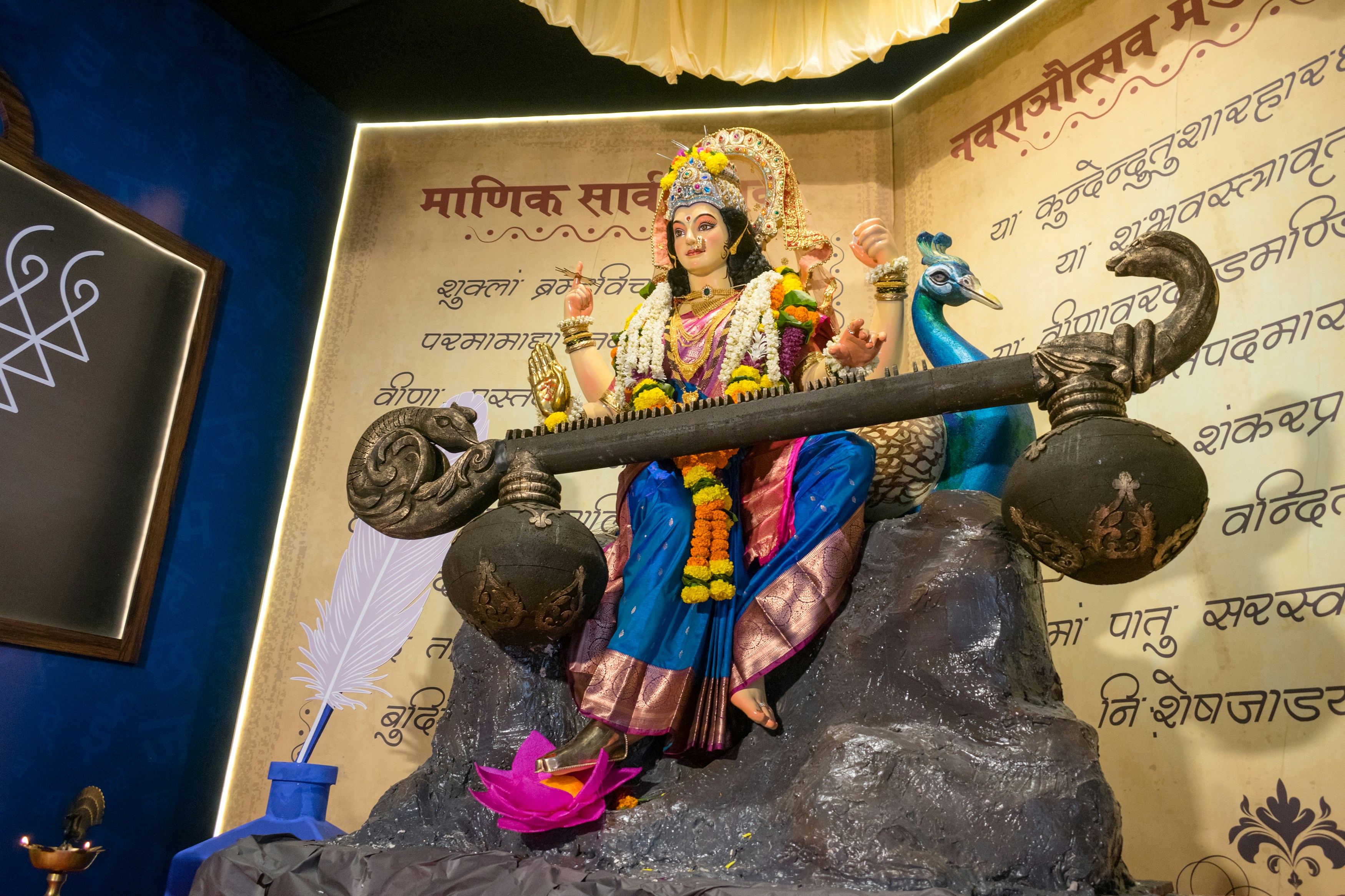 A beautiful idol of Maa Durga as Saraswati being worshipped at a Hindu temple in Mumbai, India for the festival of Navratri or Durga Puja
