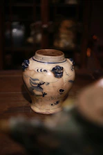 Antique ceramic vase with blue dragon motif