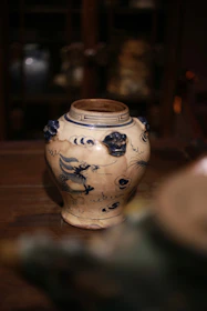 Antique ceramic vase with blue dragon motif