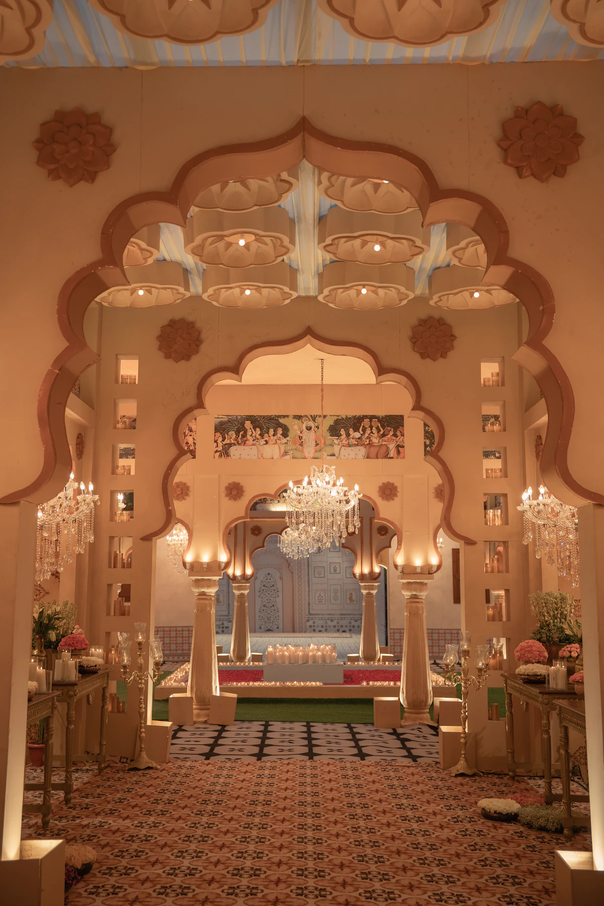 Ornate archway entrance with chandeliers and seating
