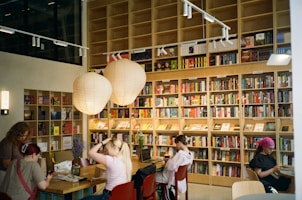 People browsing books in a well-stocked bookstore