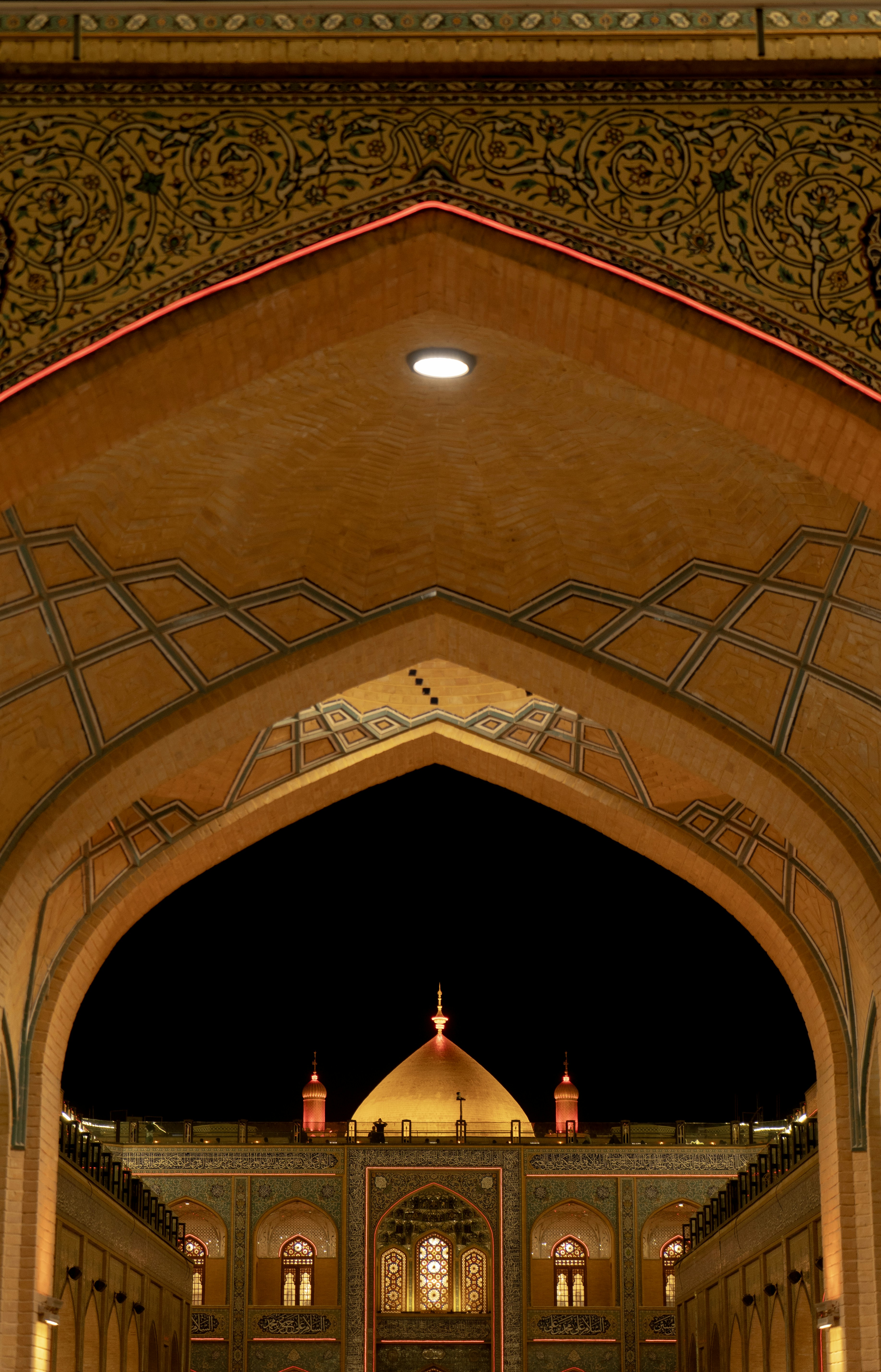 Golden dome of a mosque at night