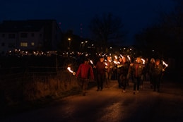 People marching at night with torches